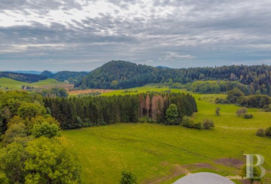 A former livestock farm which has been transformed into a vast, comfortable home near to Nantua in the Haut-Bugey region - photo  n°2